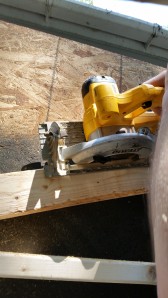 Cutting angles are not easy! So hubby used my cordless Dewalt saw and used the 2x4 as a guide and cut off the piece to be flush with the frame